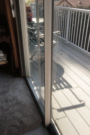 Installed sliding door draft stopper vertical alignment - Increases Protection from Winds and Drafts for Sliding Glass Doors and Windows