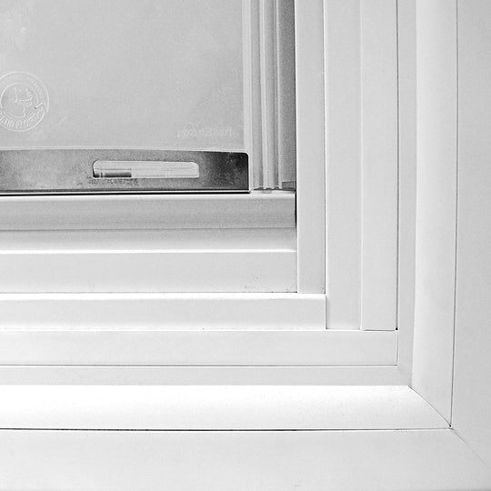 Close-up View of the Step-Over of a Pet Door in the Glass of a Patio Door
