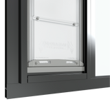 Close-up of the black Thermo Sash 3e pet door for sash window, focusing on the bottom closure and the rubber seal for sash windows, ensuring insulation and weatherproofing for this window pet door.
