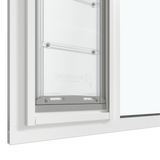 Close-up of the white Thermo Sash 3e pet door for sash window, focusing on the bottom closure and the rubber seal for sash windows, ensuring insulation and weatherproofing for this window pet door.