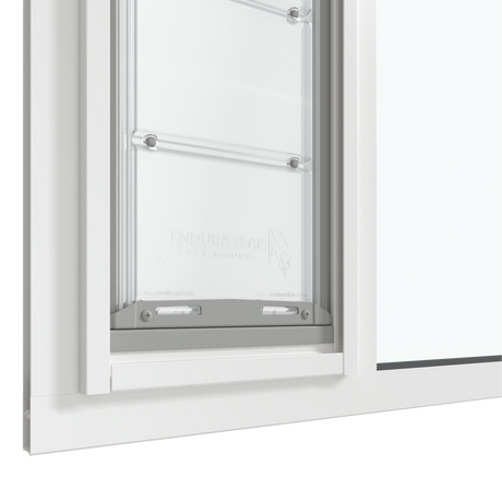 Close-up of the white Thermo Sash 3e pet door for sash window, focusing on the bottom closure and the rubber seal for sash windows, ensuring insulation and weatherproofing for this window pet door.
