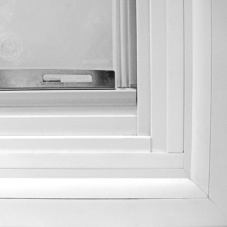 Close-up View of the Step-Over of a Pet Door in the Glass of a Patio Door